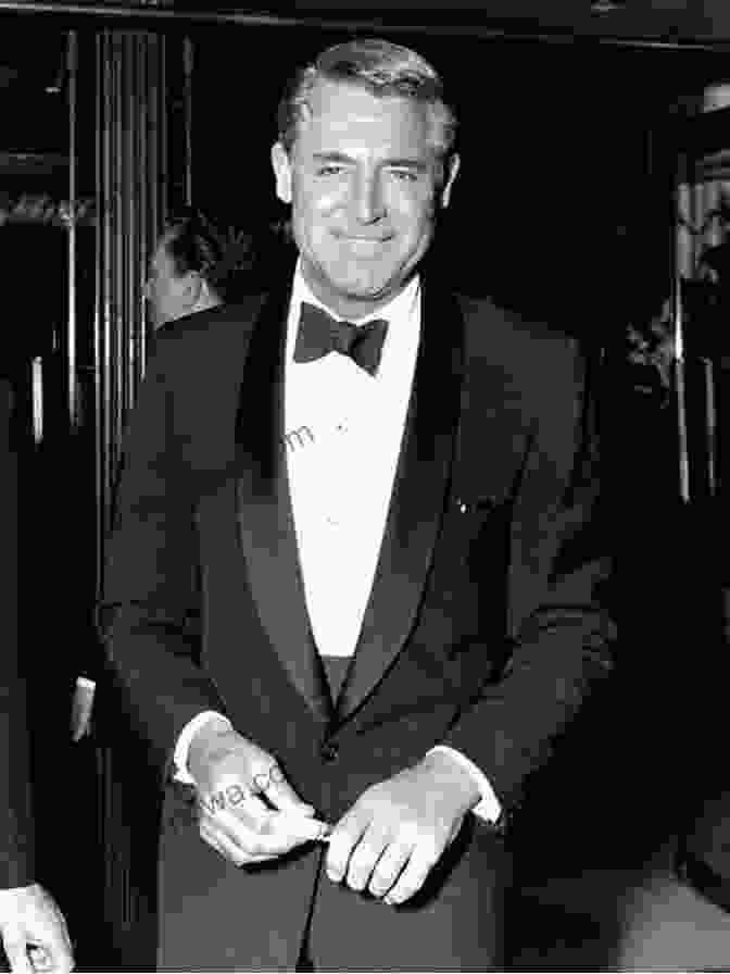 Cary Grant In A Tuxedo, Smiling And Holding A Cigarette Cary Grant: Dark Angel Geoffrey Wansell